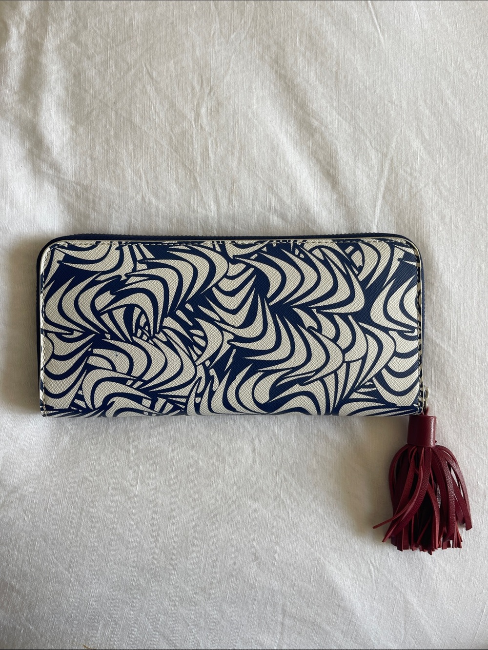 Diane Von Furstenberg Navy and White Zebra Swirl Zip Wallet with Burgundy Tassel